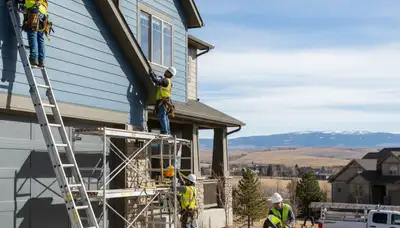 Denver, CO siding contractor installing durable vinyl siding on a home exterior